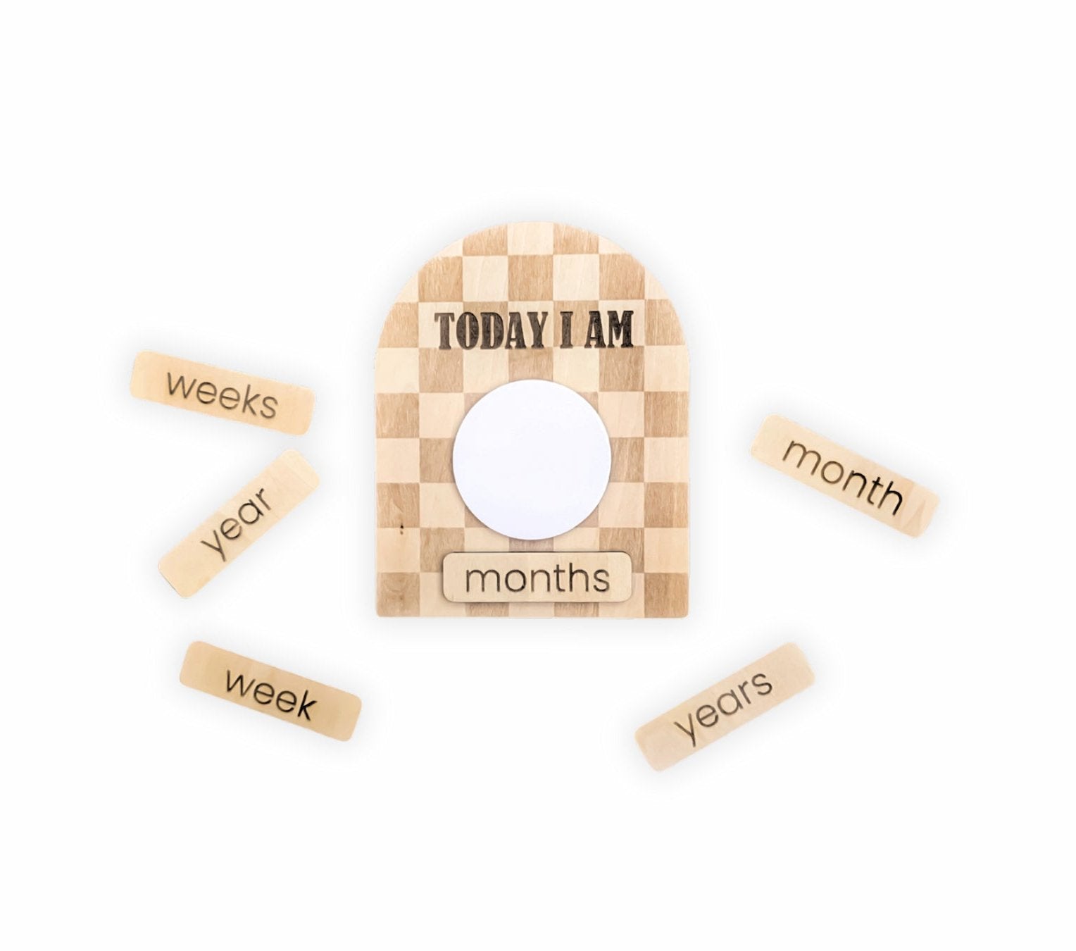 Complete set of the dry-erase baby milestone plaques with a checkered design and interchangeable elements for weeks to years, displayed on a plain background.