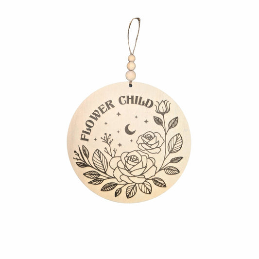 Full view of a wooden sign engraved with 'Flower Child,' adorned with floral and celestial details, perfect for adding a whimsical touch to a child's room or nursery