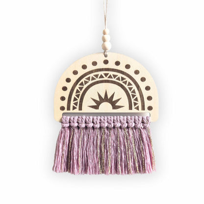 Semi-circle wooden sign with an engraved rainbow design and dusty pink and gold tassels, displayed on a plain background.