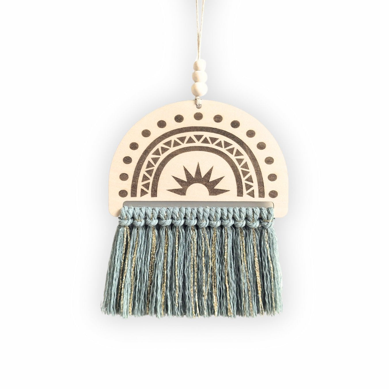 Semi-circle wooden sign with an engraved rainbow design and sage green and gold tassels, displayed on a plain background.