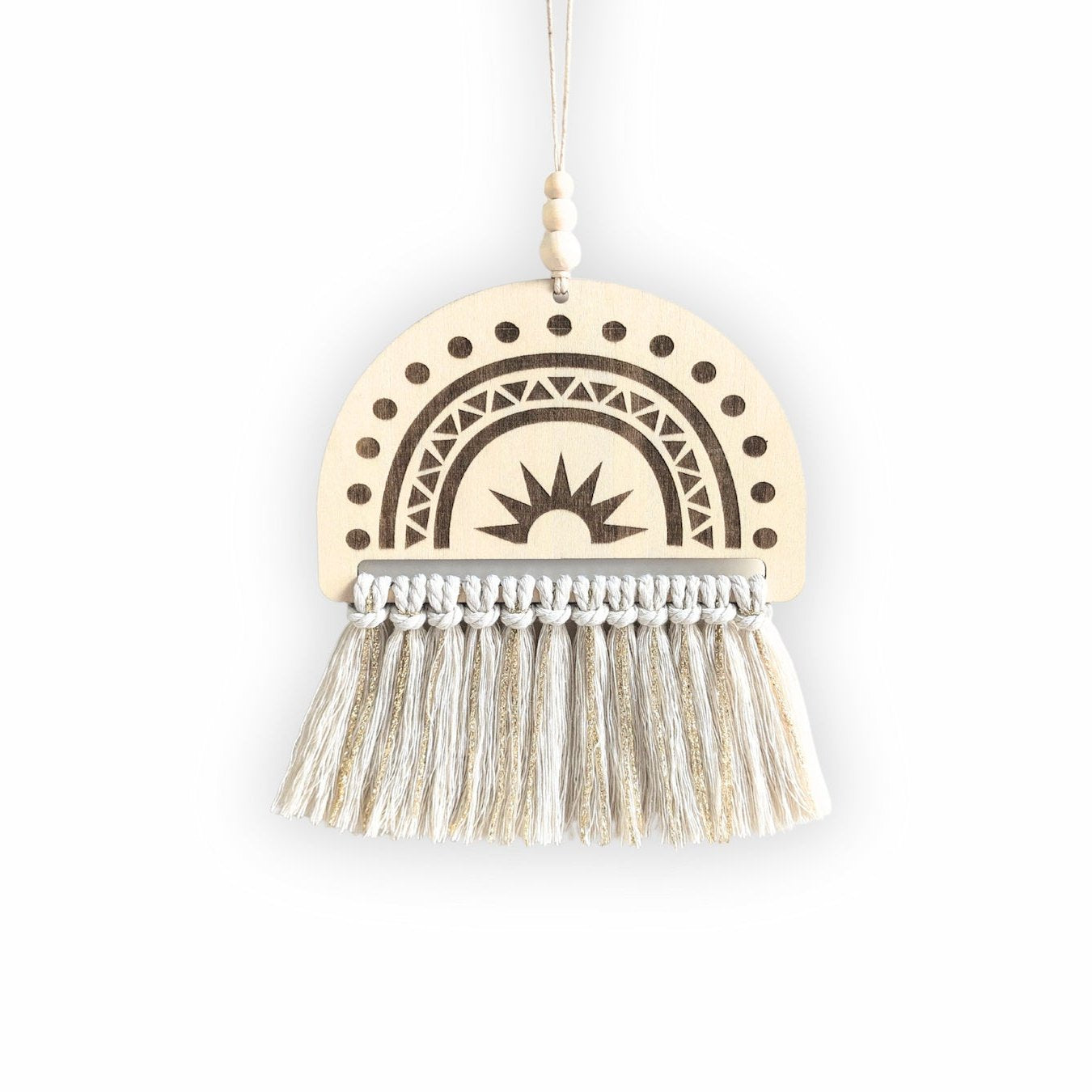 Semi-circle wooden sign with an engraved rainbow design and natural white and gold tassels, displayed on a plain background.